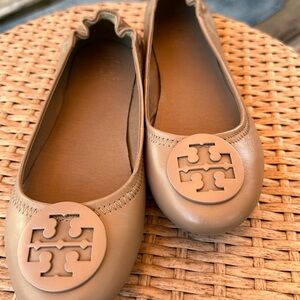 Tory Burch closed toe shoes.